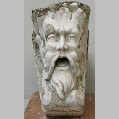 Antique keystone in sculpted stone