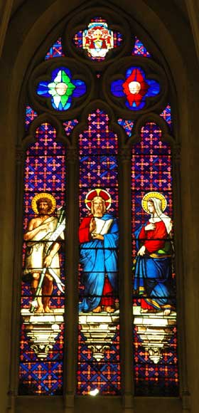 Stained glass window from a chapel with Jesus as central figure Stained glass window from a chapel with Jesus as central figure-0