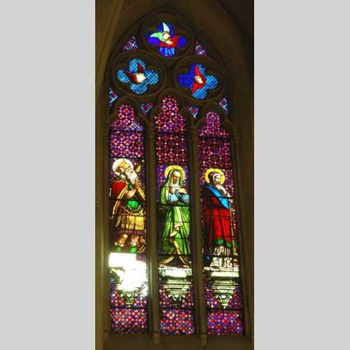 Stained glass window from a chapel with Mary as central figure