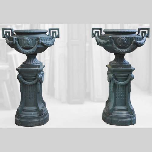 Pair of cast iron Louis XVI style vase with theirs originals bases