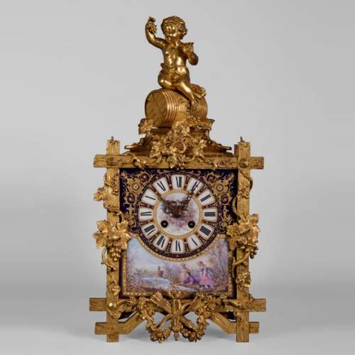 A Napoleon III style clock made out of porcelain and gilded bronze representing Bacchus, god of wine