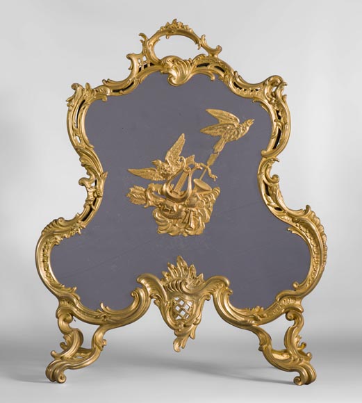 Antique Louis XV style firescreen in gilt bronze with birds and music instruments decoration Antique Louis XV style firescreen in gilt bronze with birds and music instruments decoration-0