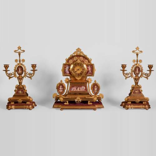 Neo-Pompeian style clock set made out of gilded bronze and red ceramic