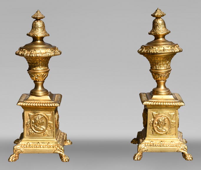 Pair of Louis XIV style gilt-bronze chenets decorated with profiles. Pair of Louis XIV style gilt-bronze chenets decorated with profiles.-0