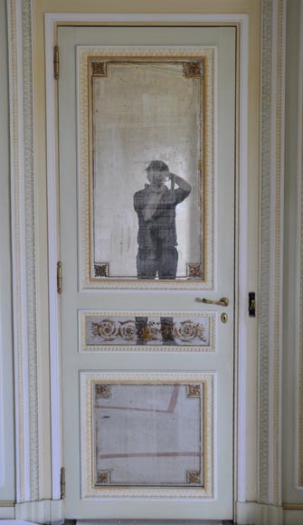 Pair of Louis XVI style wood, stucco and mirror doors, circa 1970 Pair of Louis XVI style wood, stucco and mirror doors, circa 1970-1