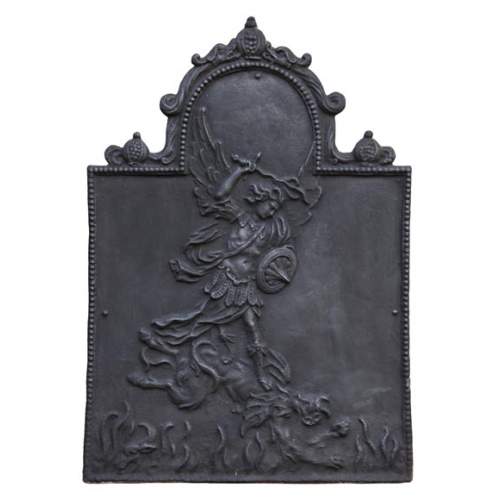 Antique fireback decorated with Saint-Michel slaying the dragon