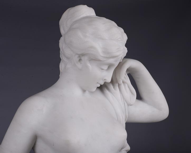 Peach blossom marble and gilt bronze clock surmounted by a statuary white marble sculpture representing Phryne in front of his judges signed Peach blossom marble and gilt bronze clock surmounted by a statuary white marble sculpture representing Phryne in front of his judges signed