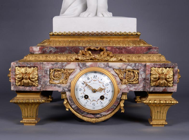 Peach blossom marble and gilt bronze clock surmounted by a statuary white marble sculpture representing Phryne in front of his judges signed Peach blossom marble and gilt bronze clock surmounted by a statuary white marble sculpture representing Phryne in front of his judges signed