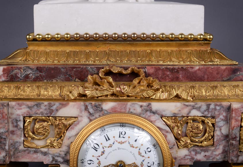 Peach blossom marble and gilt bronze clock surmounted by a statuary white marble sculpture representing Phryne in front of his judges signed Peach blossom marble and gilt bronze clock surmounted by a statuary white marble sculpture representing Phryne in front of his judges signed