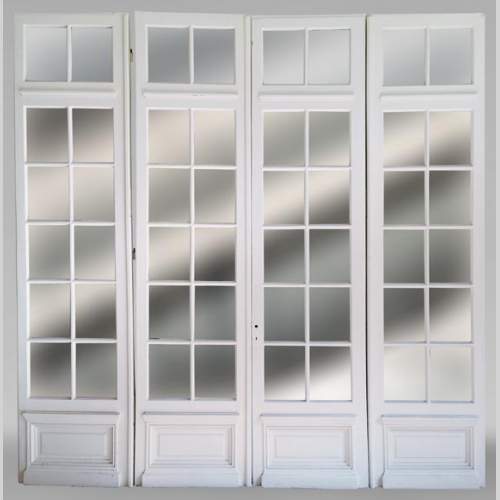 Large quadruple door with panes and mirrors