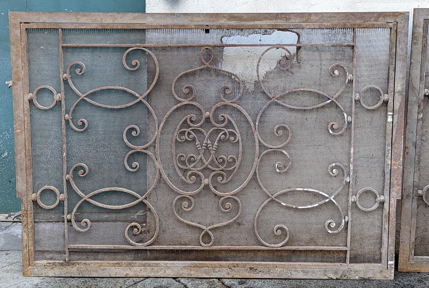 Pair of wrought iron front radiators with intertwined L Pair of wrought iron front radiators with intertwined L-1