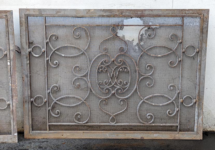 Pair of wrought iron front radiators with intertwined L Pair of wrought iron front radiators with intertwined L-2