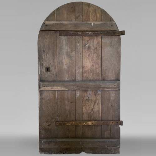 Oak door with rounded top from the 18th century
