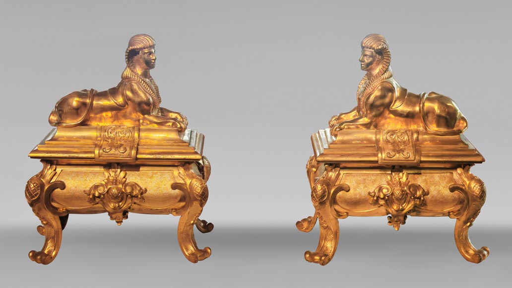 Pair of Napoleon III style gilt-bronze chenets featuring sphinxes Pair of Napoleon III style gilt-bronze chenets featuring sphinxes-0