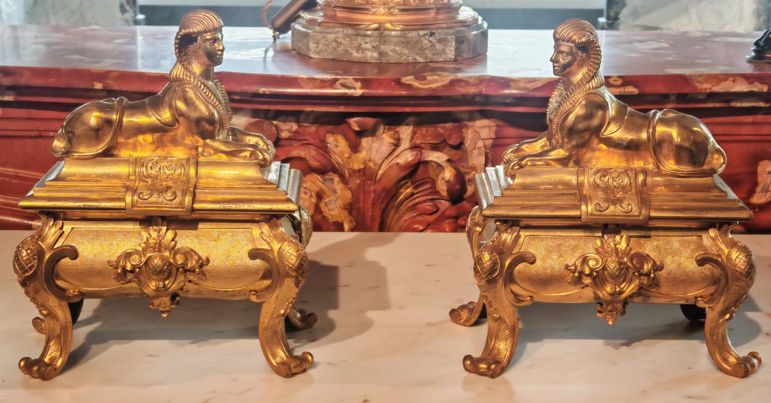 Pair of Napoleon III style gilt-bronze chenets featuring sphinxes Pair of Napoleon III style gilt-bronze chenets featuring sphinxes-1