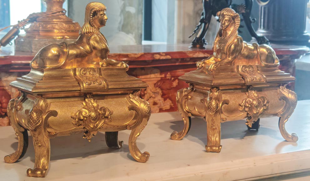 Pair of Napoleon III style gilt-bronze chenets featuring sphinxes Pair of Napoleon III style gilt-bronze chenets featuring sphinxes-2