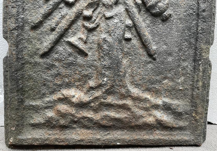 17th century fireback decorated with a warrior trophy surmounted by a medallion with a double portrait 17th century fireback decorated with a warrior trophy surmounted by a medallion with a double portrait-3