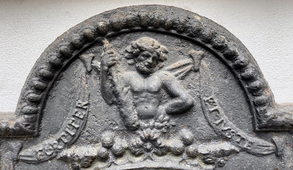 18th century fireback with two shields surrounded by three wild men 18th century fireback with two shields surrounded by three wild men-1