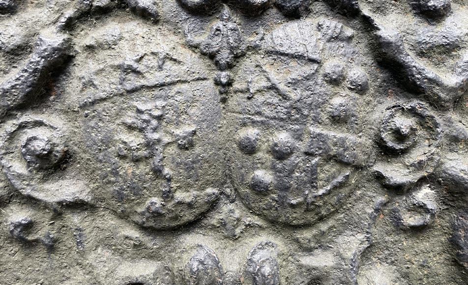 18th century fireback with two shields surrounded by three wild men 18th century fireback with two shields surrounded by three wild men-5