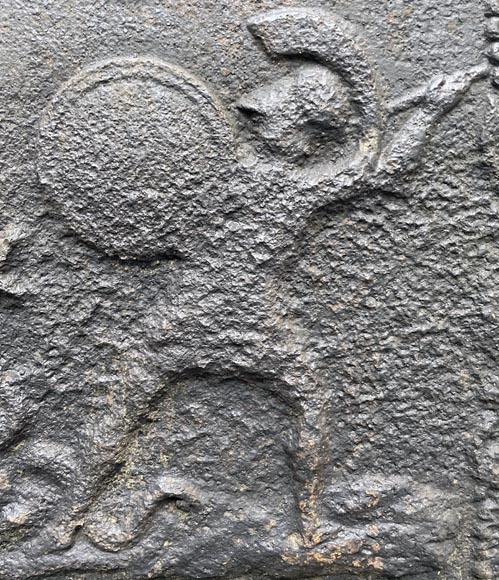 19th century fireback representing a mythological battle scene 19th century fireback representing a mythological battle scene-1