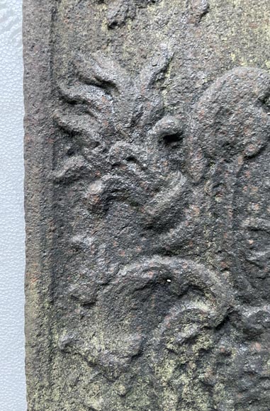 Small fireback in the Louis XV style, decorated with a medallion featuring an illuminated C. Small fireback in the Louis XV style, decorated with a medallion featuring an illuminated C.-4