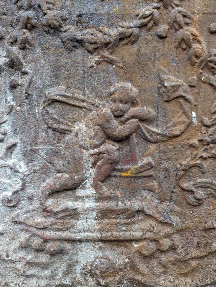 Fireback from the 19th century in the Louis XV style with the Fireback from the 19th century in the Louis XV style with the