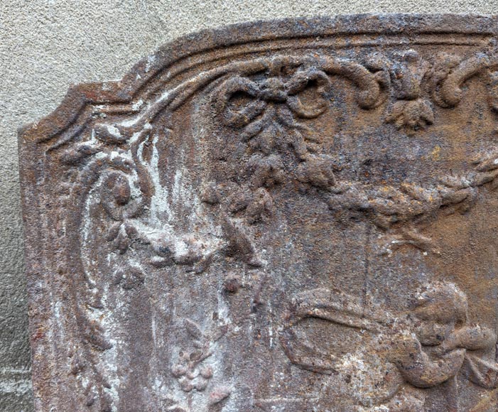 Fireback from the 19th century in the Louis XV style with the Fireback from the 19th century in the Louis XV style with the