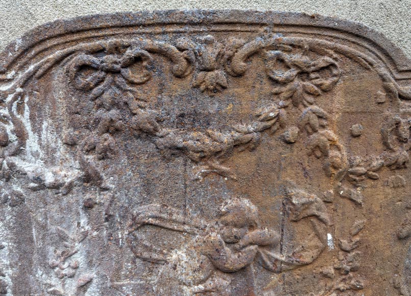 Fireback from the 19th century in the Louis XV style with the Fireback from the 19th century in the Louis XV style with the