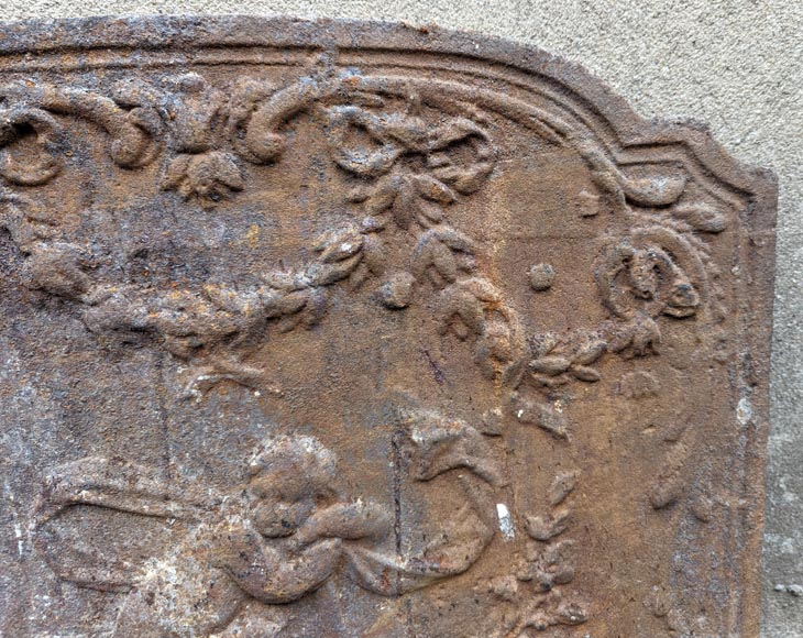 Fireback from the 19th century in the Louis XV style with the Fireback from the 19th century in the Louis XV style with the