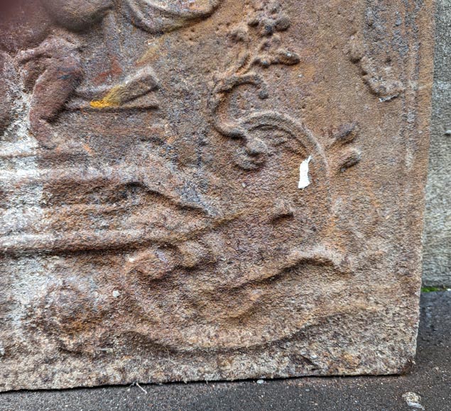 Fireback from the 19th century in the Louis XV style with the Fireback from the 19th century in the Louis XV style with the