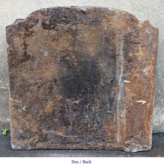 Fireback from the 19th century in the Louis XV style with the Fireback from the 19th century in the Louis XV style with the