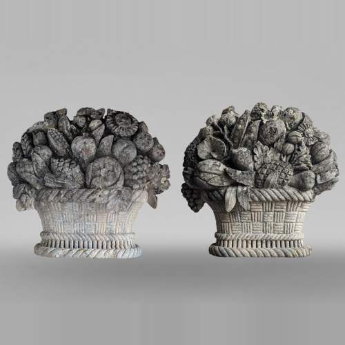 Important pair of carved stone fruit baskets