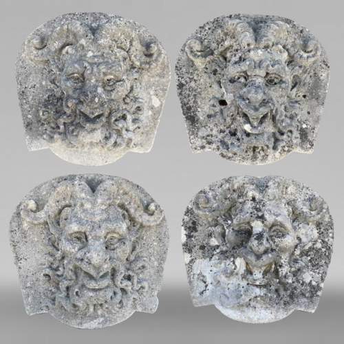 Set of Four Carved Stone Medallions Depicting Satyr Faces