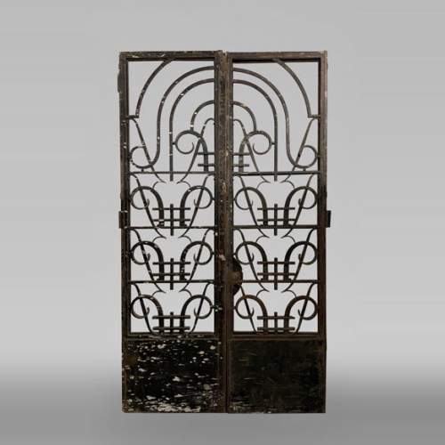 Double cast iron door with geometric decoration
