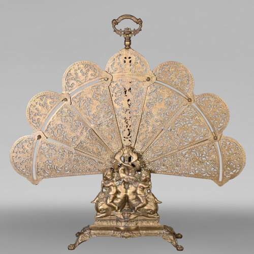 Large Napoleon III style fan-shaped fire screen with dolphin and putti decoration
