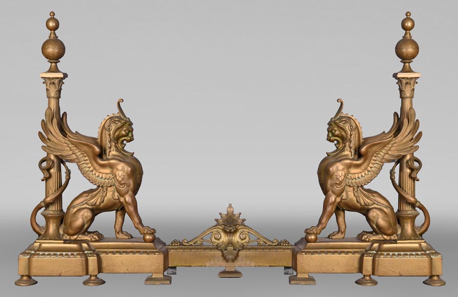 Pair of Egyptian-style gilt-bronze firedogs with confronting griffins-1