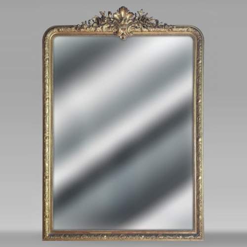 Large Regence style gilded trumeau surmounted by a palm leaf