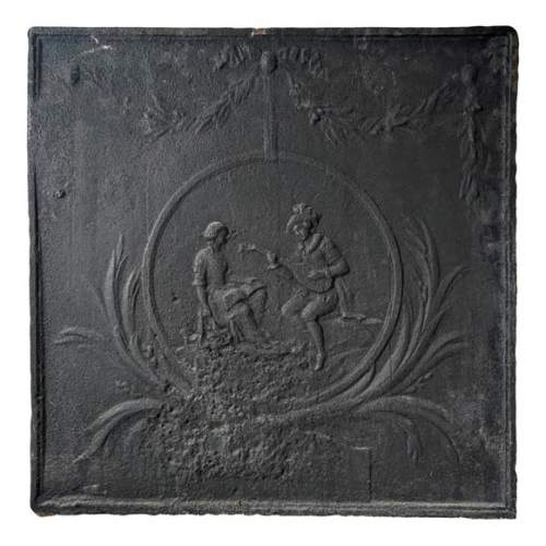 Louis XVI style fireback with lute player