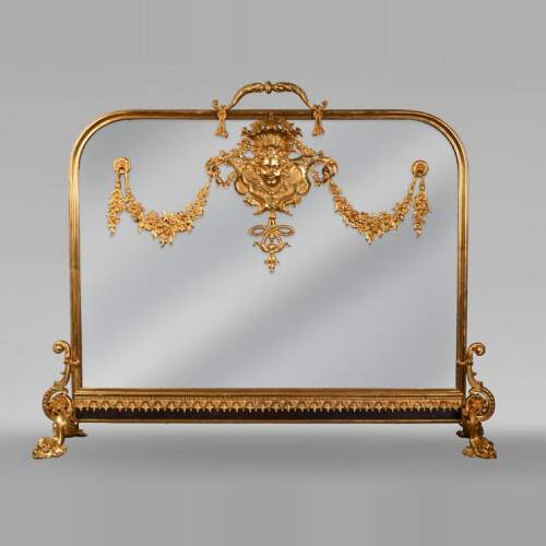 Napoleon III style fireback with woman's mask and garland of flowers in gilded bronze and glass.