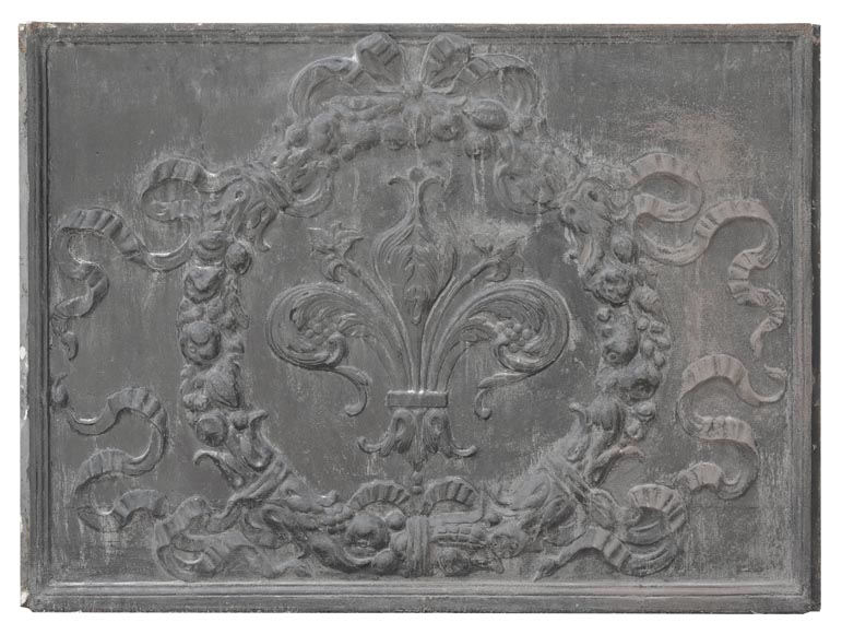 Napoleon III style fireback with a stylized fleur-de-lis, surrounded by a wreath of plants Napoleon III style fireback with a stylized fleur-de-lis, surrounded by a wreath of plants-0