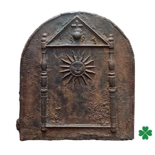 Cast iron fireback dated 1693, decorated with a radiant sun and architectural symbols