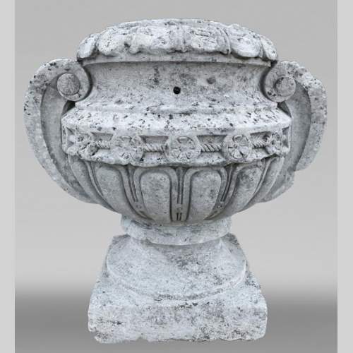 Carved stone outdoor vase with spiral handle