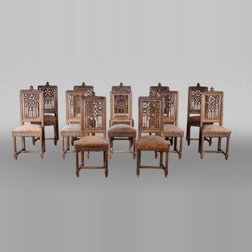 Set of 12 Neo-Gothic chairs featuring four different types of openwork backs