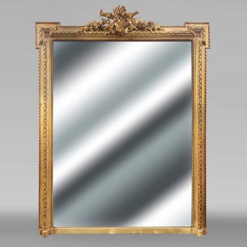 Gilded Louis XVI style trumeau with musical instruments