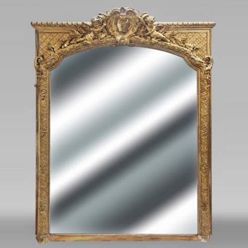 A richly gilded trumeau in the Napoleon III style, decorated with putti