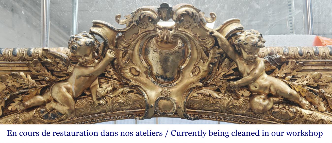 A richly gilded trumeau in the Napoleon III style, decorated with putti-1