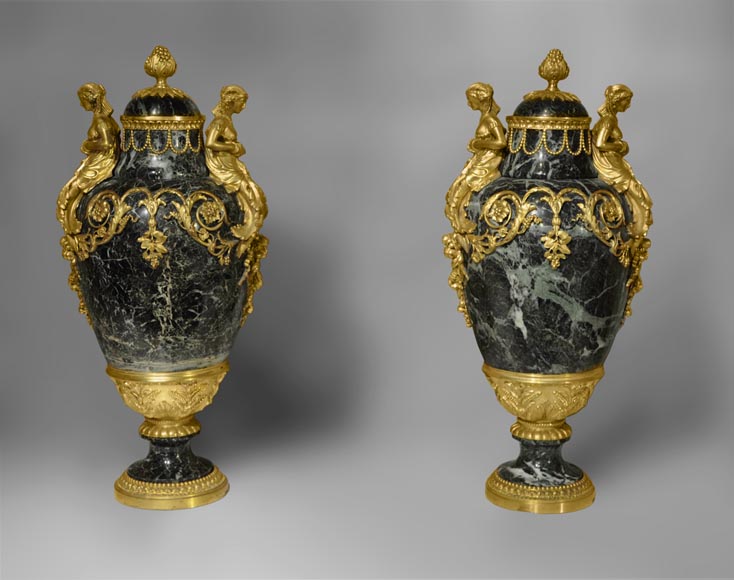 A pair of giltbronze mounted Sea Green marble covered vases with Egyptian women A pair of giltbronze mounted Sea Green marble covered vases with Egyptian women-0
