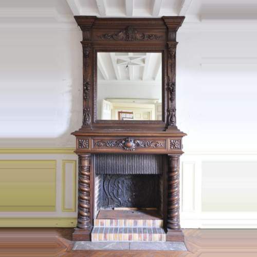 Antique walnut fireplace with Satyr mask