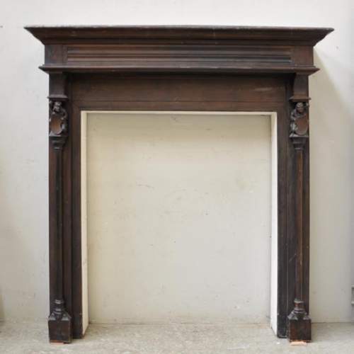 Antique Neo-gothic style wood fireplace with troubadours