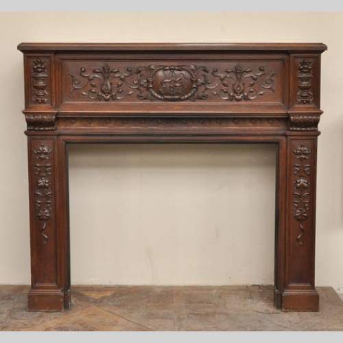 Antique Napoleon III style oak wood fireplace with 
